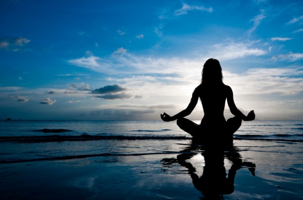 woman-meditating-ocean